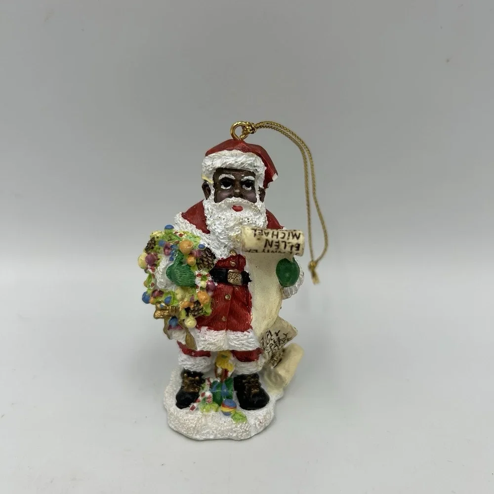 The International‎ Santa Claus Collection 1997 African American Santa Flawed